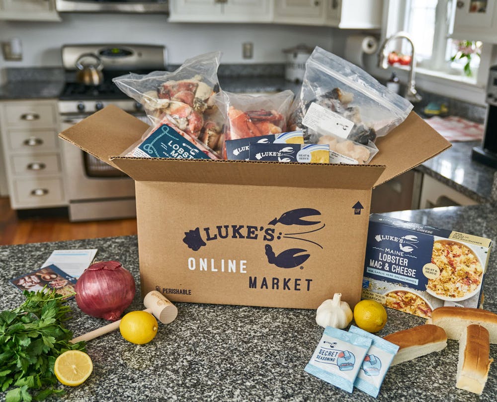 box filled with many luke's lobster products