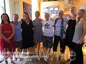 The artist, third from right, pictured with her subjects.