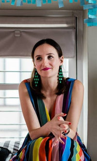 Meaghan Dillon: brown haired girl wearing a bright dress