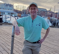 Mikey smiling while posing on the Pier