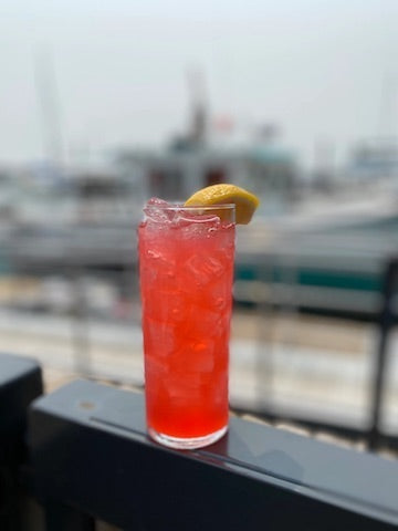 a cocktail on the deck overlooking the harbor