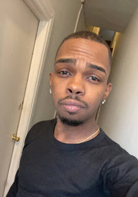 Tyrik posing for a selfie wearing a black long sleeve shirt