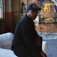 Evan Lee wearing a baseball posing for a picture