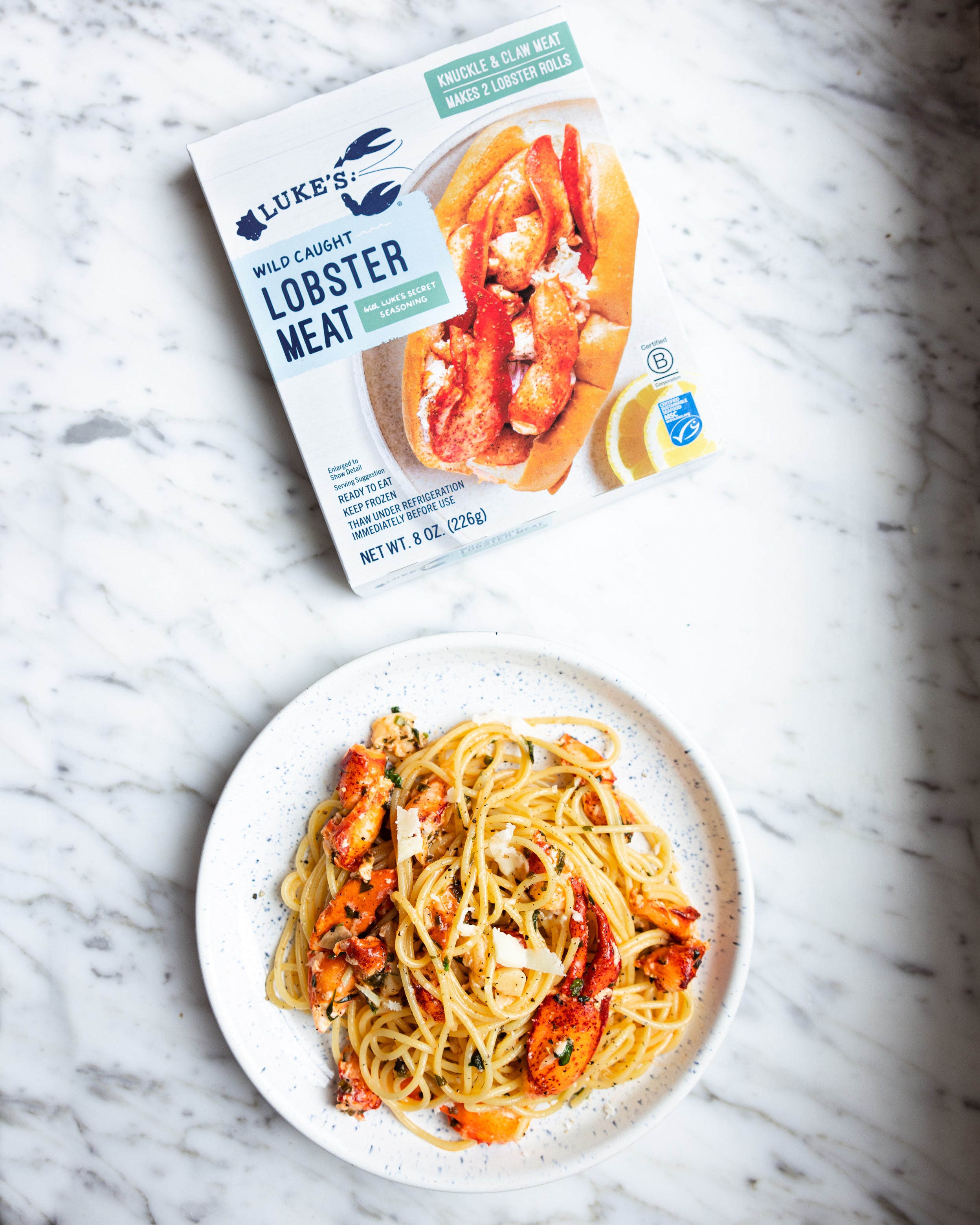 lobster meat package above a photo of lobster pasta