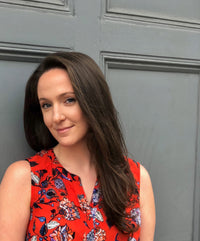 Morgan Kamensky; women in a short sleeved red shirt