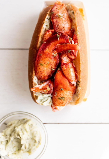 A Lobster Roll on a wooden table